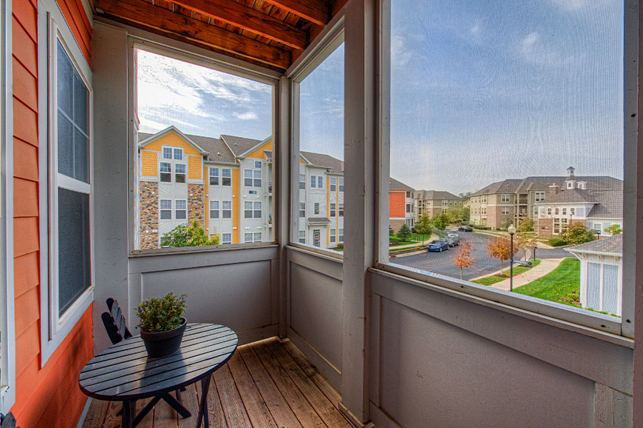 A peaceful and serene view from an enclosed balcony at Union Street Flats Apartments. Enclosed balcony with a beautiful view of other apartment complexes.